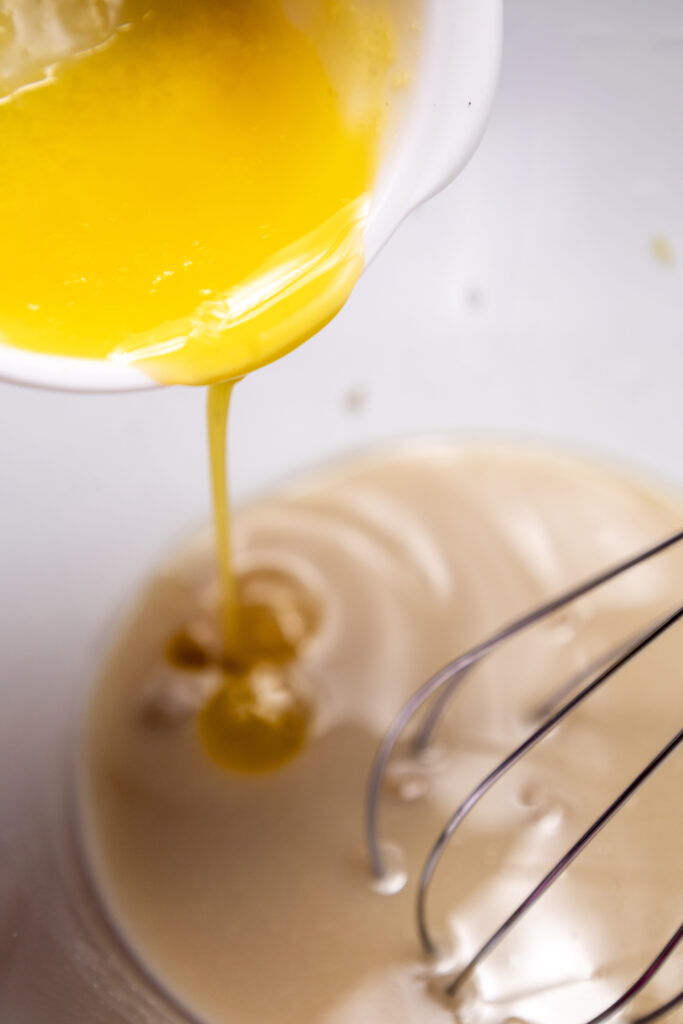 Pumpkin Cinnamon Rolls - Cultivating Brilliant Minds Adding melting butter to batter