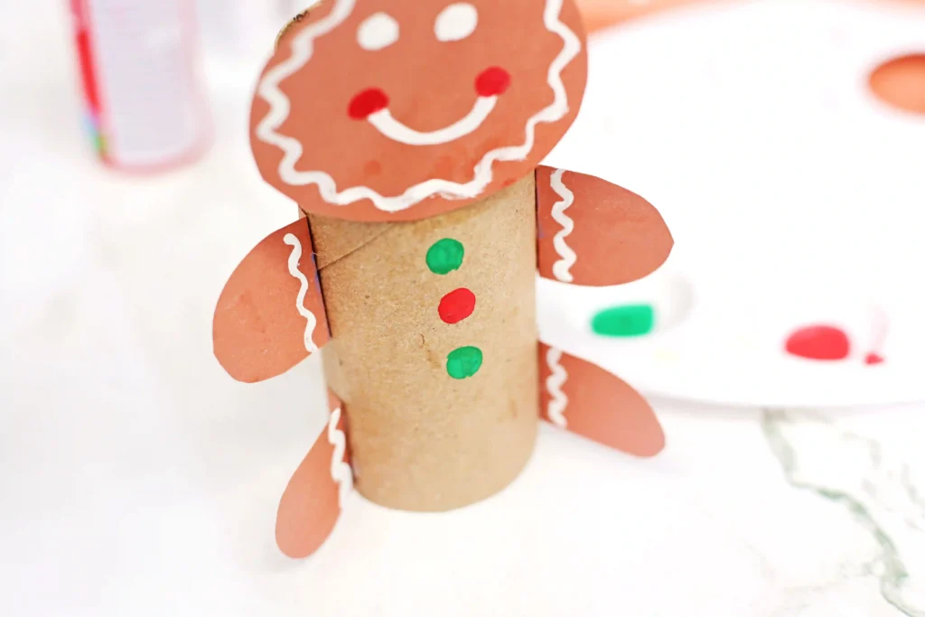 gingerbread man craft made out of a toilet paper roll