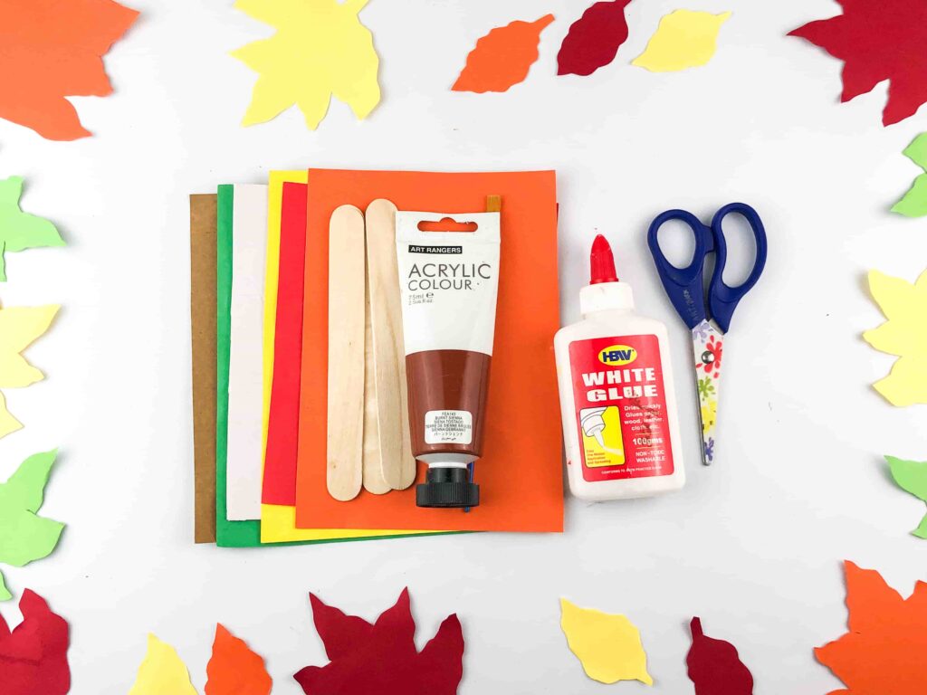 Thanksgiving Turkey Popsicle Stick Craft - Cultivating Brilliant Minds craft paper, popsicle sticks, paint, glue, and scissors