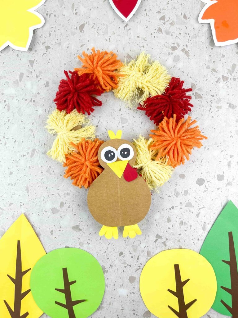 Thanksgiving Turkey Wreath Craft - Cultivating Brilliant Minds A thanksgiving turkey wreath craft using yarn