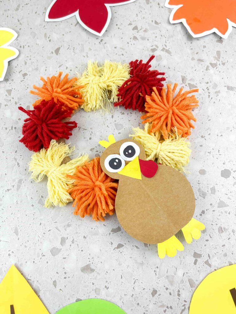 Thanksgiving Turkey Wreath Craft - Cultivating Brilliant Minds A thanksgiving turkey wreath craft using yarn