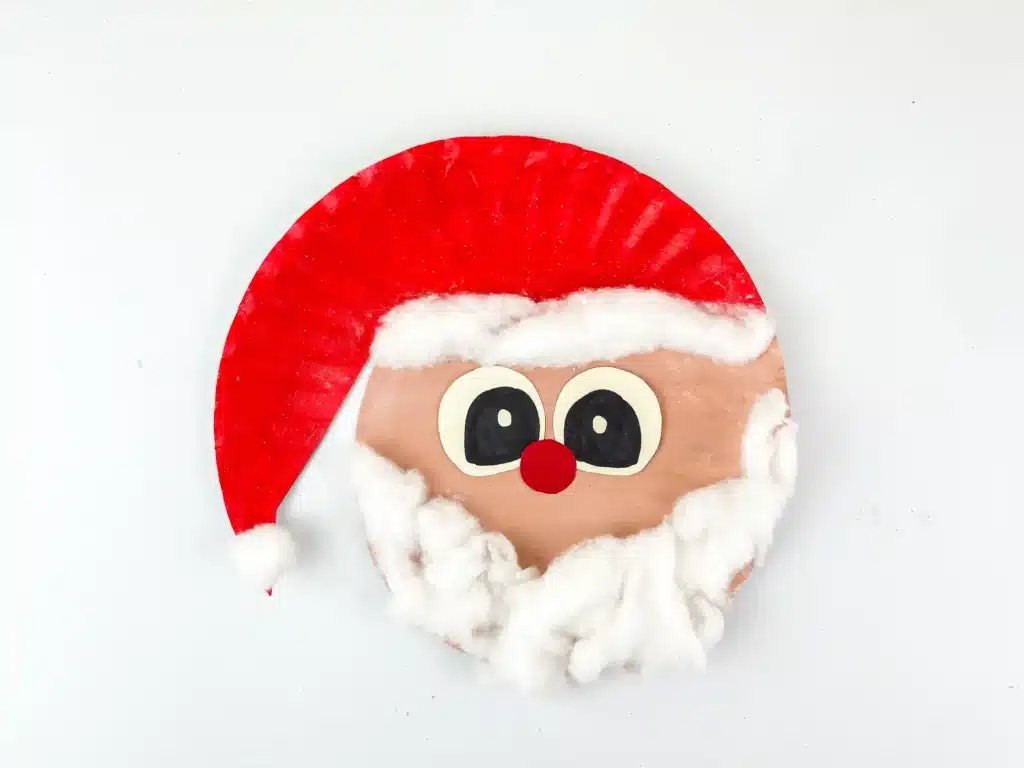 Santa Paper Plate Craft - Cultivating Brilliant Minds a paper plate painted and decorated to look like santa