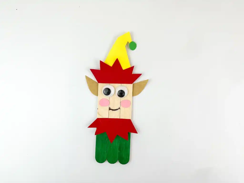 popsicle sticks decorated to look like an elf