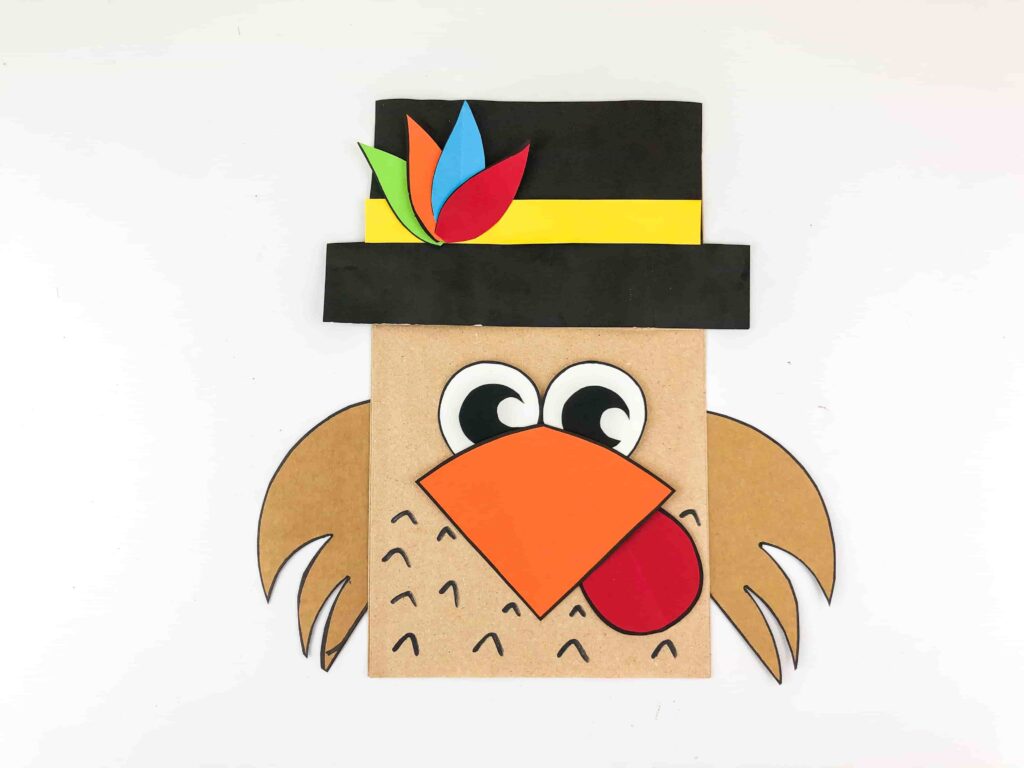 Thanksgiving Turkey Paper Bag Craft - Cultivating Brilliant Minds a paper bag decorated to look like a turkey