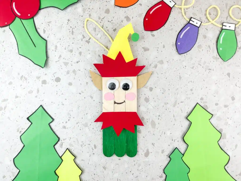 popsicle sticks decorated to look like an elf