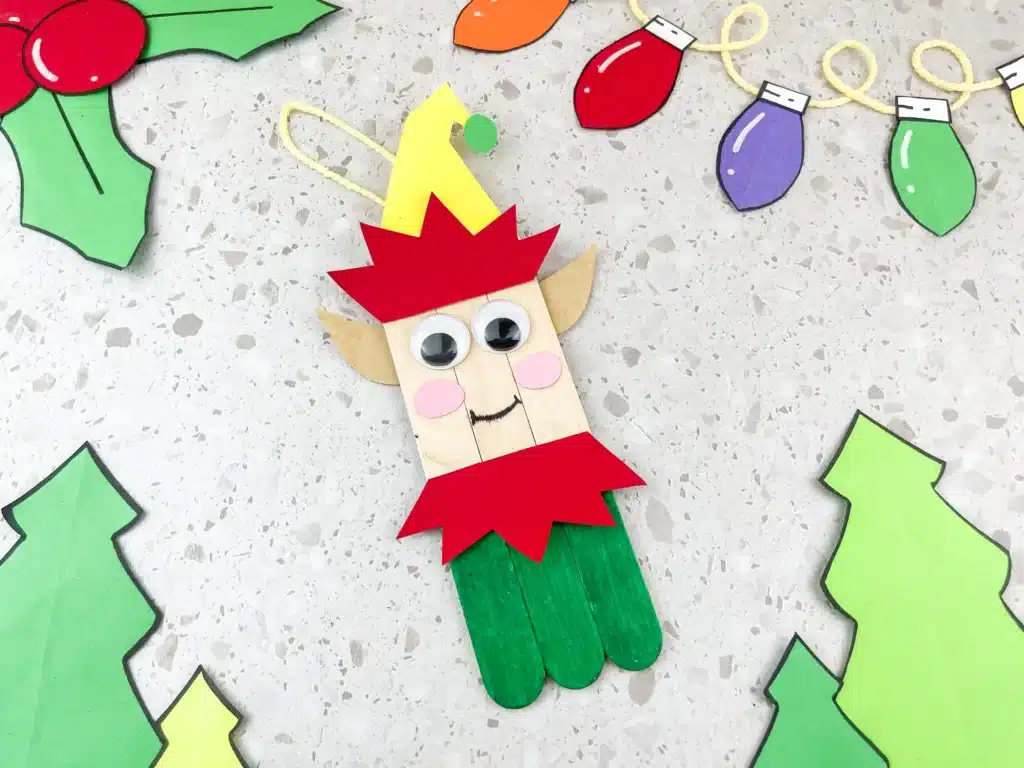 popsicle sticks decorated to look like an elf