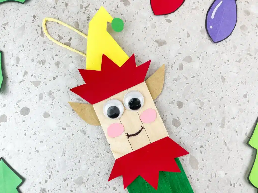 popsicle sticks decorated to look like an elf