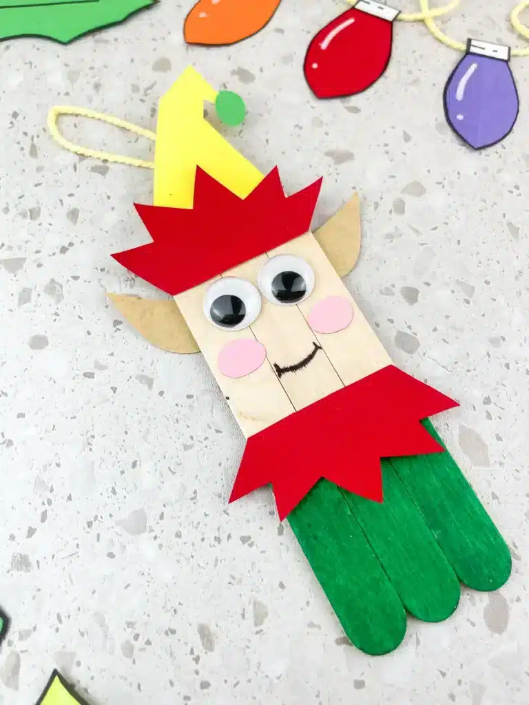 elf popsicle stick ornament - popsicle sticks decorated to look like an elf