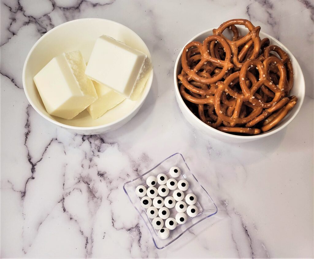 Ghost Pretzels For Halloween - Cultivating Brilliant Minds ingredients for ghost pretzels in bowls