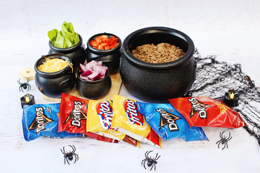 Spooky Walking Taco Bar - Cultivating Brilliant Minds Spooky Walking Taco Bar - ingredients are in cauldrons