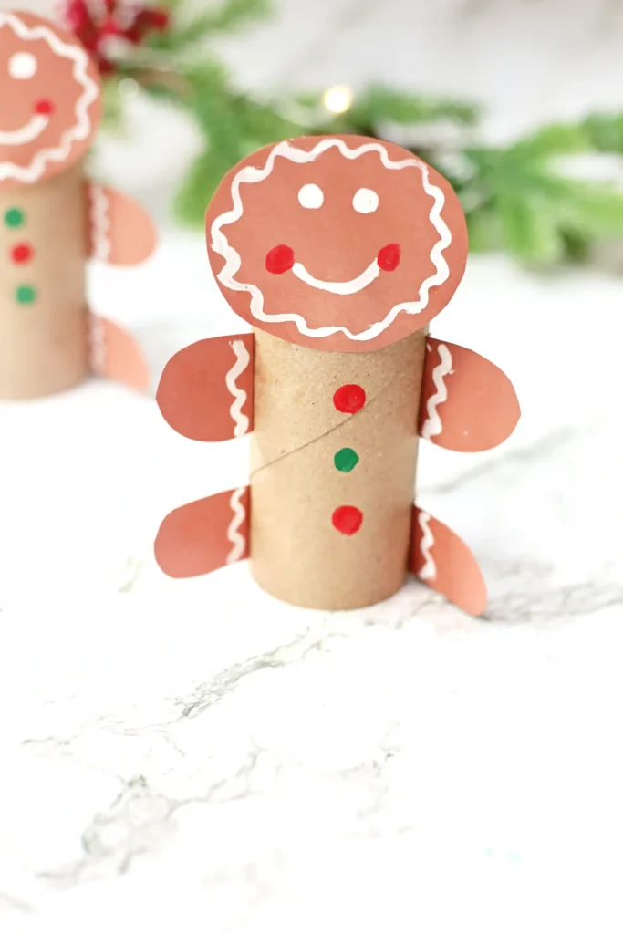gingerbread man craft made out of a toilet paper roll