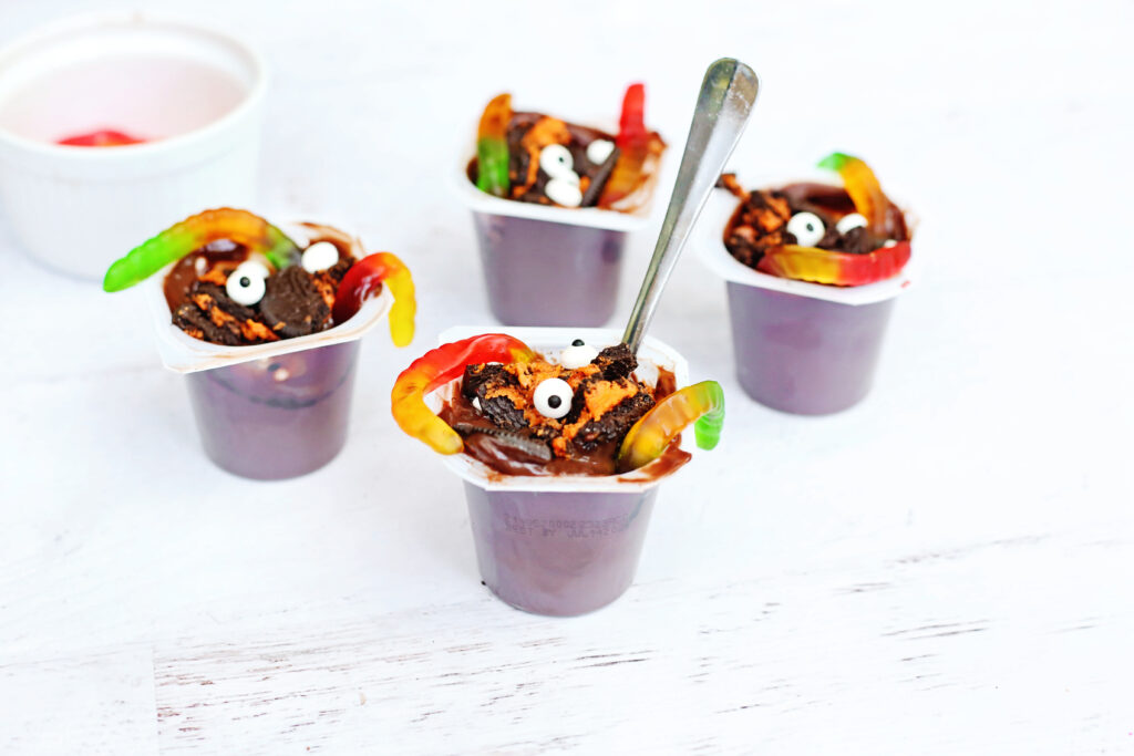 Witchs Brew Pudding Cups - Cultivating Brilliant Minds Witchs Brew Pudding Cups with eyeballs and gummy worms
