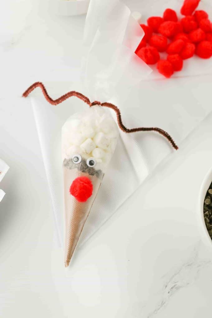 Reindeer Hot Chocolate - Cultivating Brilliant Minds hot chocolate mix in a plastic piping bag decorated to look like a reindeer