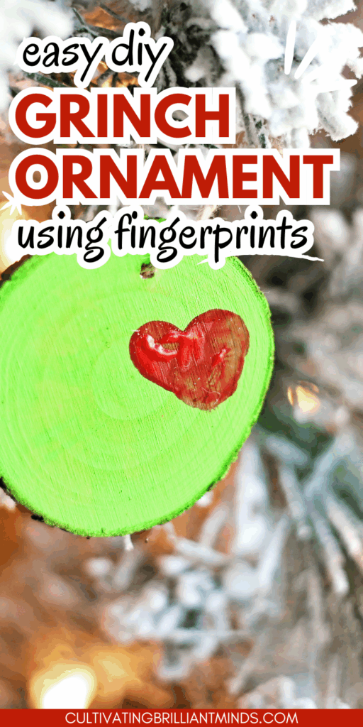Grinch Heart Wood Slice Ornament Craft - Cultivating Brilliant Minds a wood slice ornament on a tree decorated to look like the grinch's heart