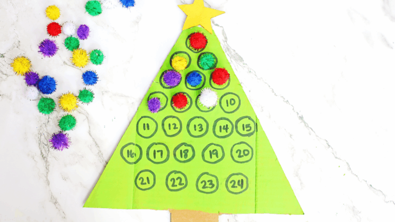 cardboard painted to look like a christmas tree with numbers on it. Pom poms are glued over some of the numbers