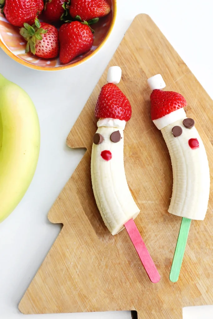 Banana Santa: A Healthy Christmas Snack - Cultivating Brilliant Minds bananas with strawberry hats made to look like Santa