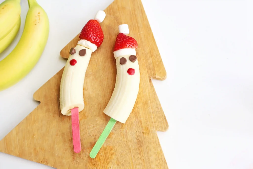 Banana Santa: A Healthy Christmas Snack - Cultivating Brilliant Minds bananas with strawberry hats made to look like Santa