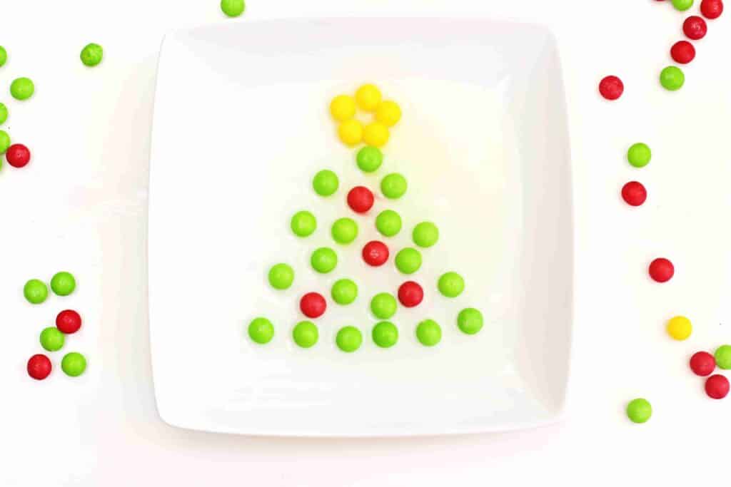 Christmas Tree Skittles Experiment - Cultivating Brilliant Minds skittles organized to look like a christmas tree