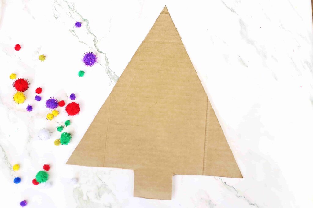 Christmas Tree Countdown Craft - Cultivating Brilliant Minds cardboard cut out to look like a christmas tree