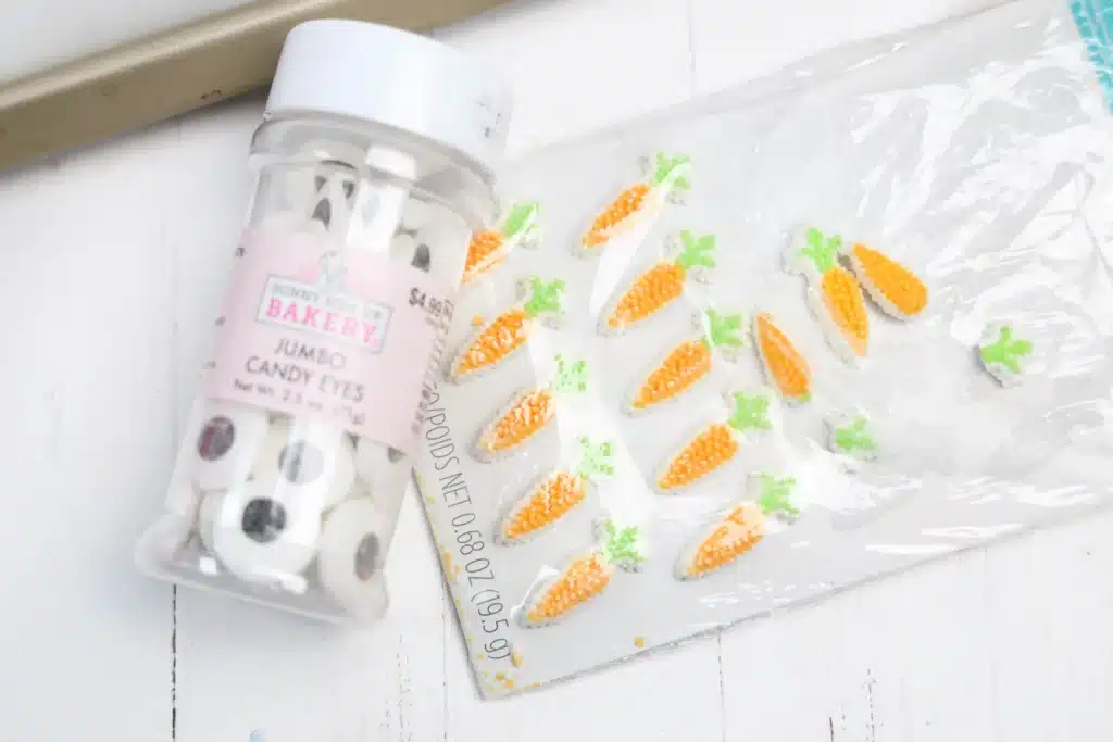 Frozen Whipped Cream Snowman - Cultivating Brilliant Minds candy eyes and carrot sprinkle icing decorations