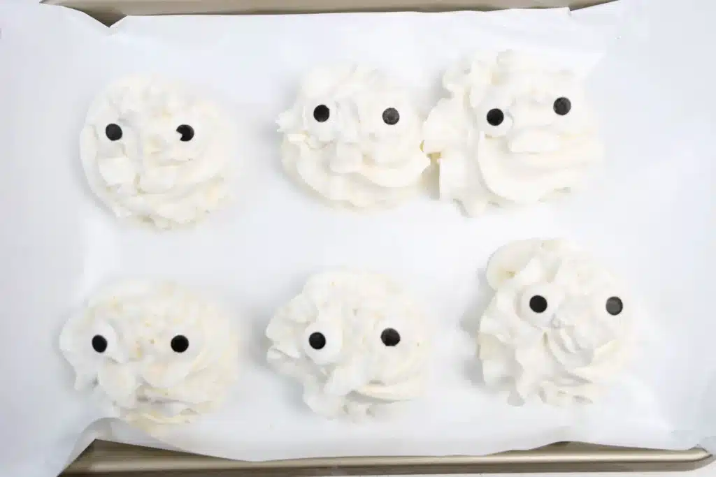 Frozen Whipped Cream Snowman - Cultivating Brilliant Minds frozen whipped cream with candy eyes