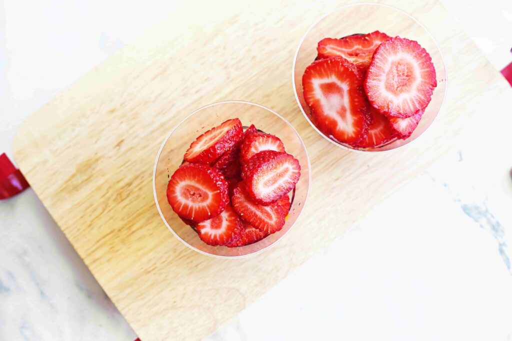 Santa fruit cups - Cultivating Brilliant Minds strawberry slices in a plastic cup