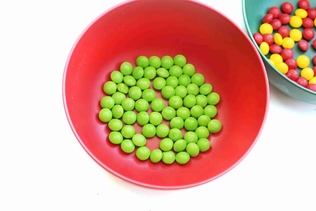 Christmas Tree Skittles Experiment - Cultivating Brilliant Minds green skittles in a bowl