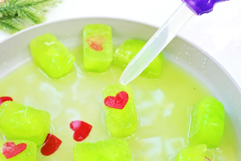 ice cubes dyed green with a heart frozen inside