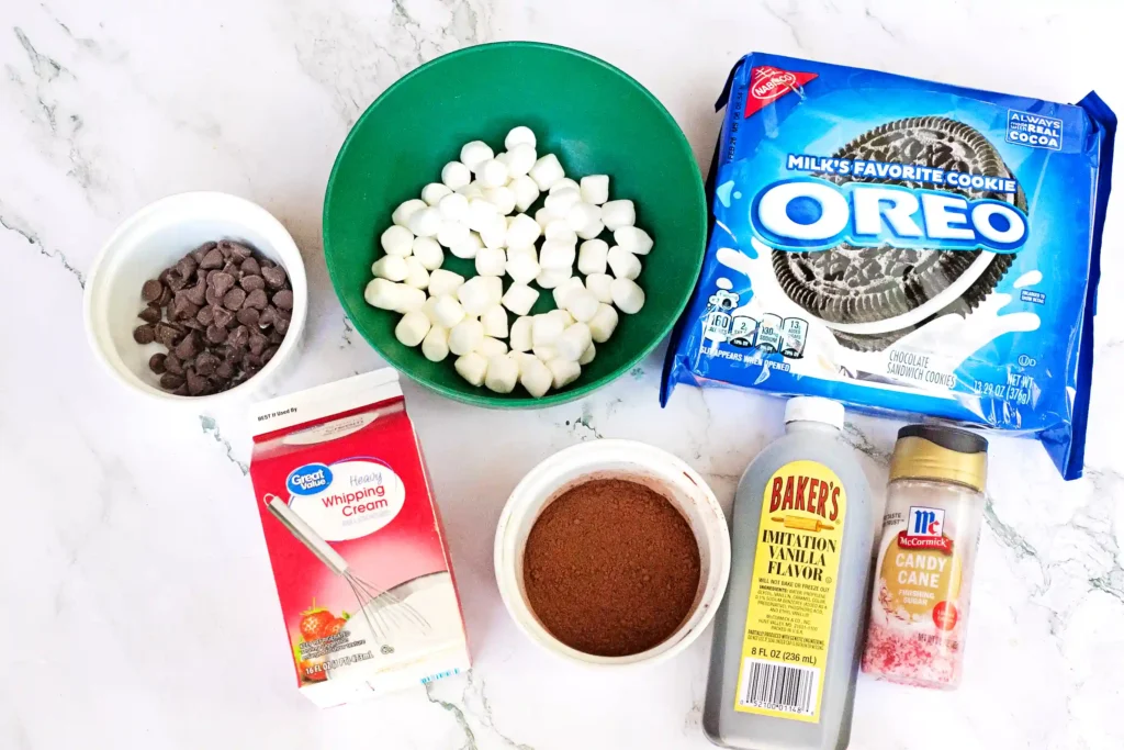 Hot Cocoa Dip - Cultivating Brilliant Minds ingredients to make hot cocoa dip: marshmallows, chocolate chips, oreos, sprinkles, honey, sugar, heavy whipping cream, cocoa mix
