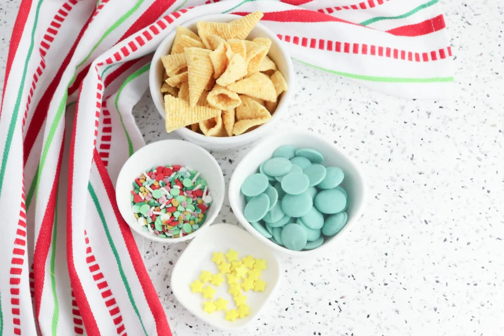 Christmas Tree Bugles - Cultivating Brilliant Minds bugles, sprinkles, and green candy melts in bowls