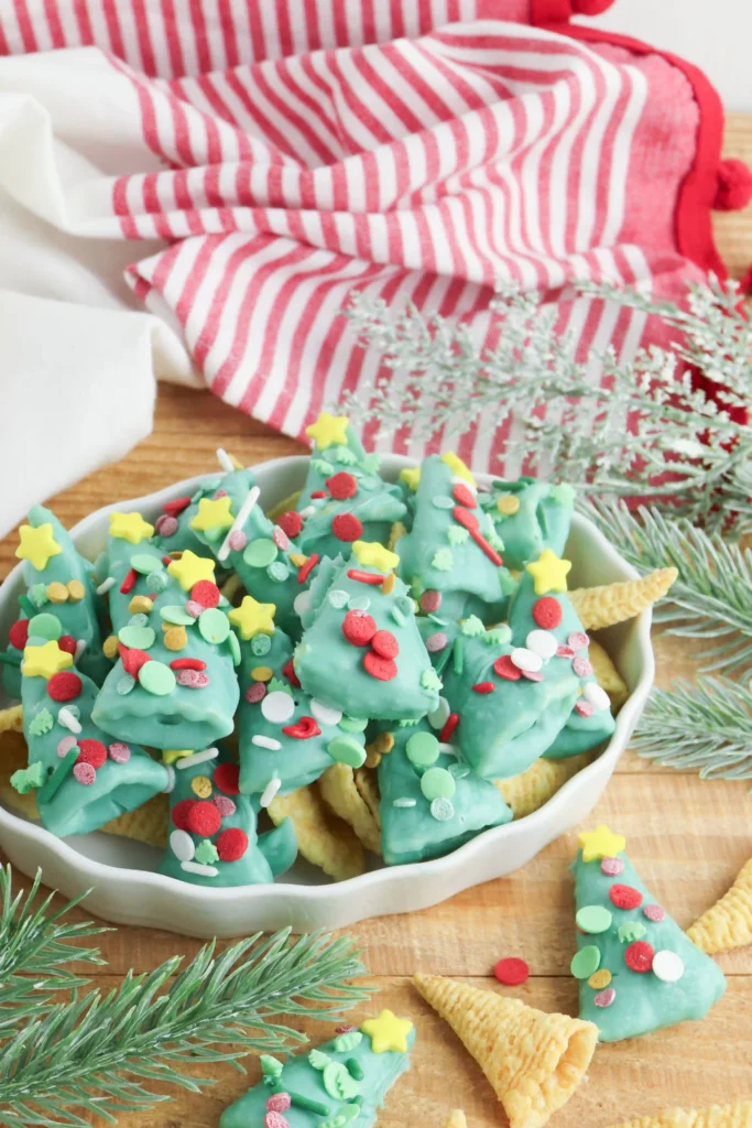 Christmas Tree Bugles - Cultivating Brilliant Minds bugles covered in green melted chocolate and sprinkles to look like christmas trees