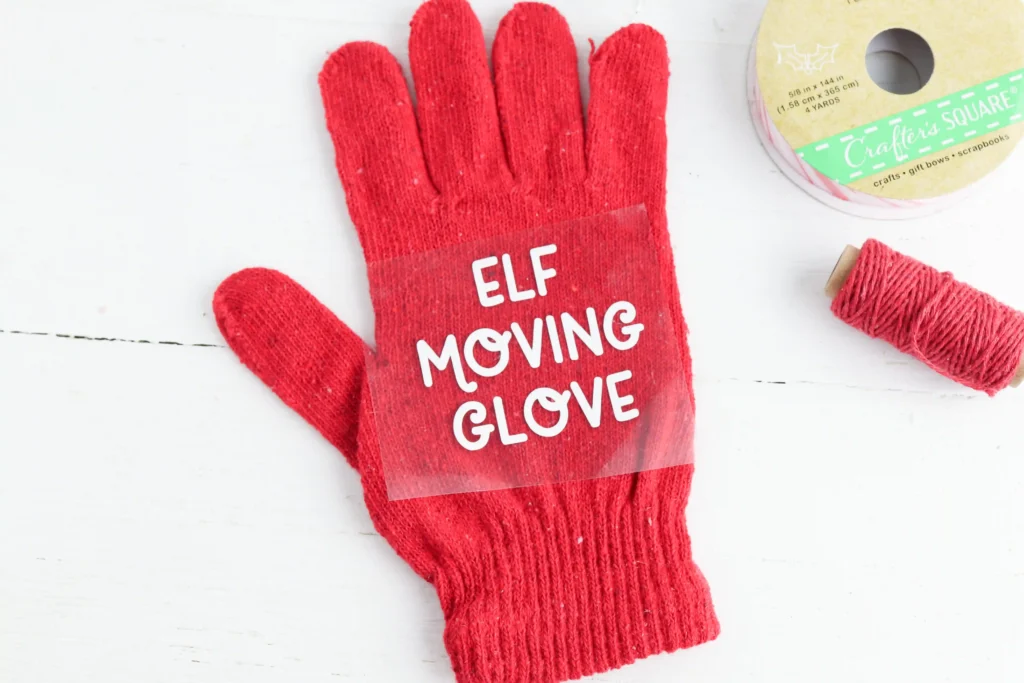ironing the "elf moving glove" design on the glove