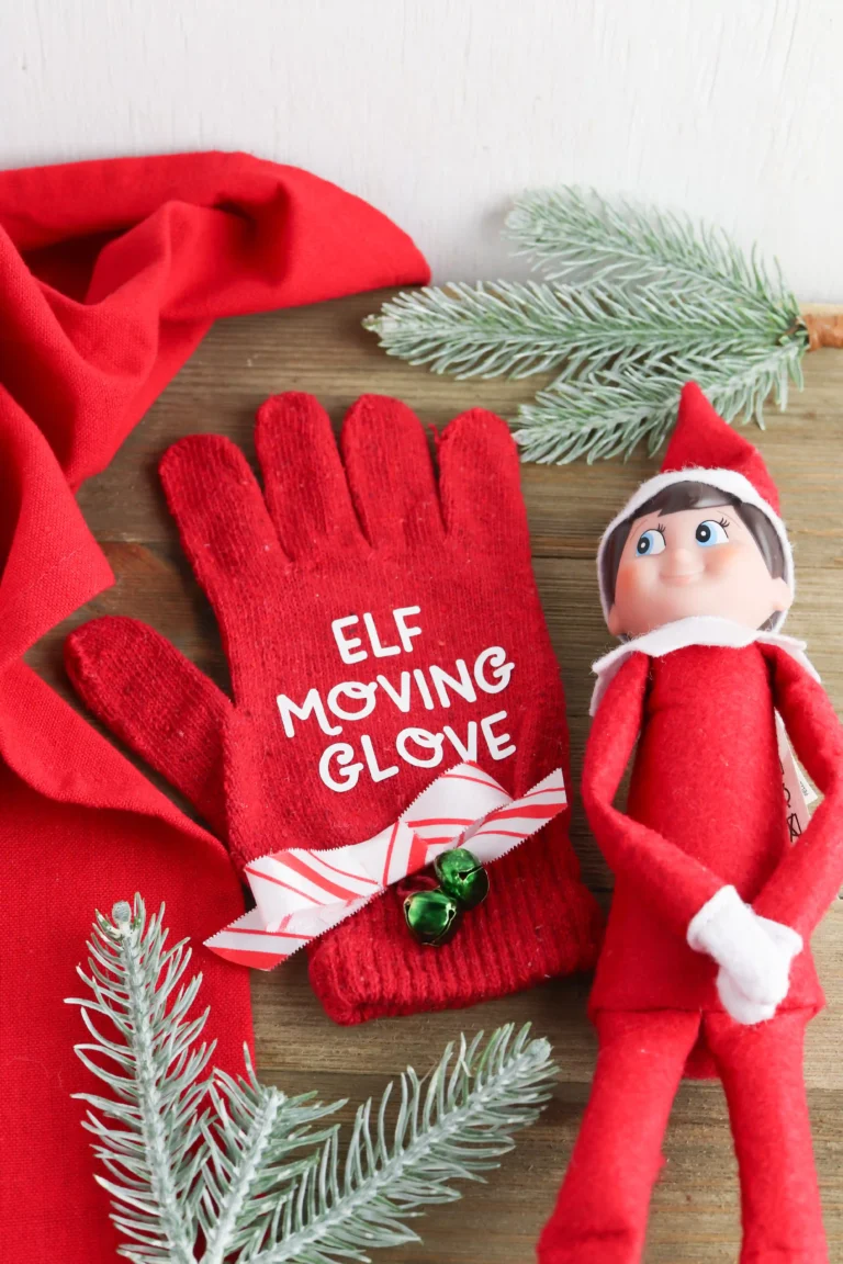and elf on the shelf next to a red glove that says "elf moving glove"