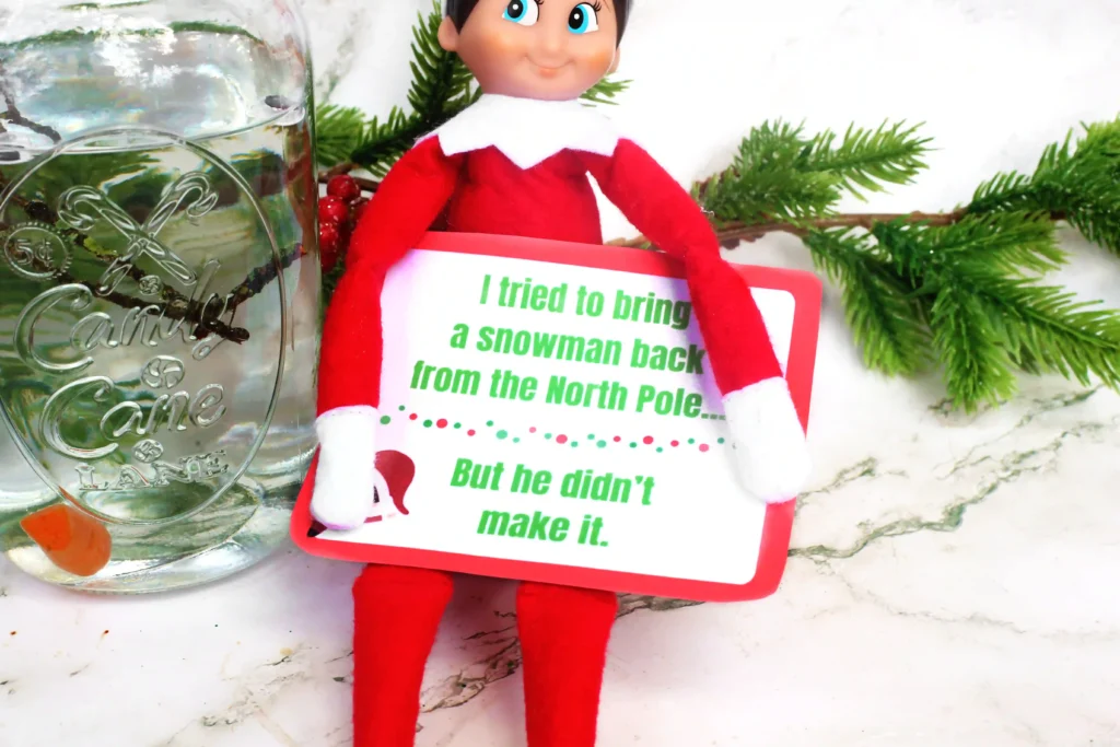 Elf on the Shelf Idea: Melted Snowman - Cultivating Brilliant Minds and elf on the shelf with a sign that reads "I tried to bring a snowman back from the north pole but he didn't make it.