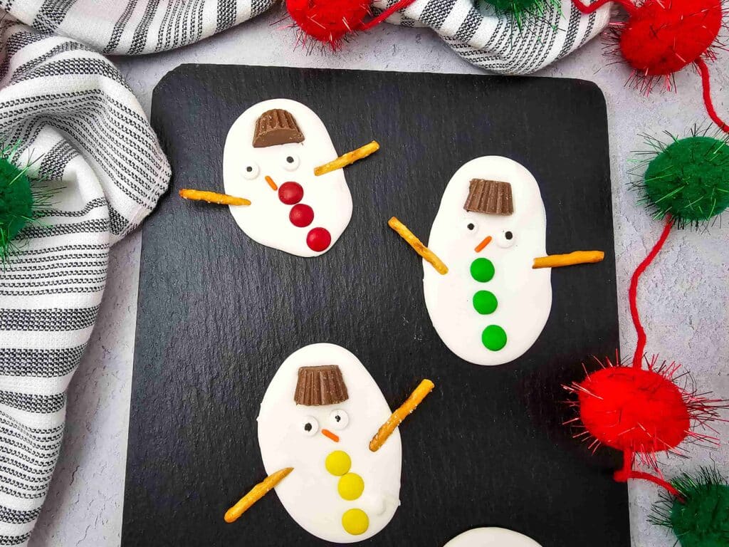 Melted Snowman Chocolate Bark - Cultivating Brilliant Minds White chocolate bark decorated to look like melted snowmen