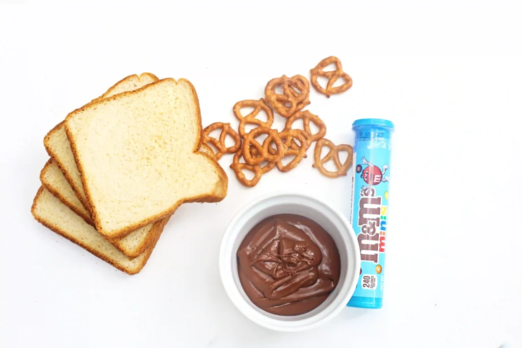 Nutella Reindeer Sandwiches - Cultivating Brilliant Minds bread, pretzels, m&ms and nutella
