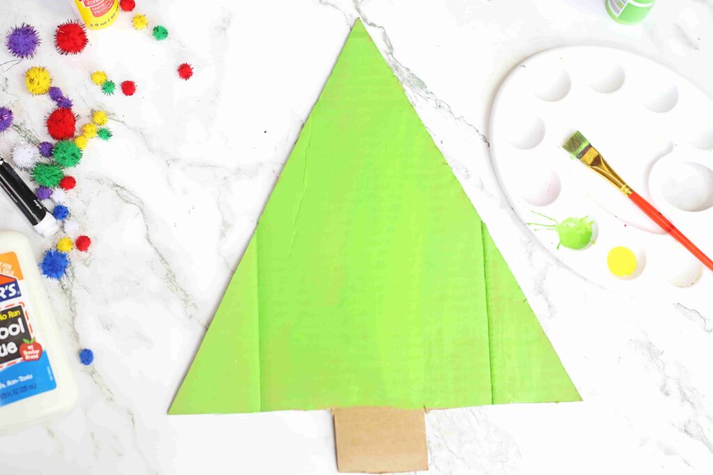 Christmas Tree Countdown Craft - Cultivating Brilliant Minds cardboard cut out to look like a christmas tree and painted green
