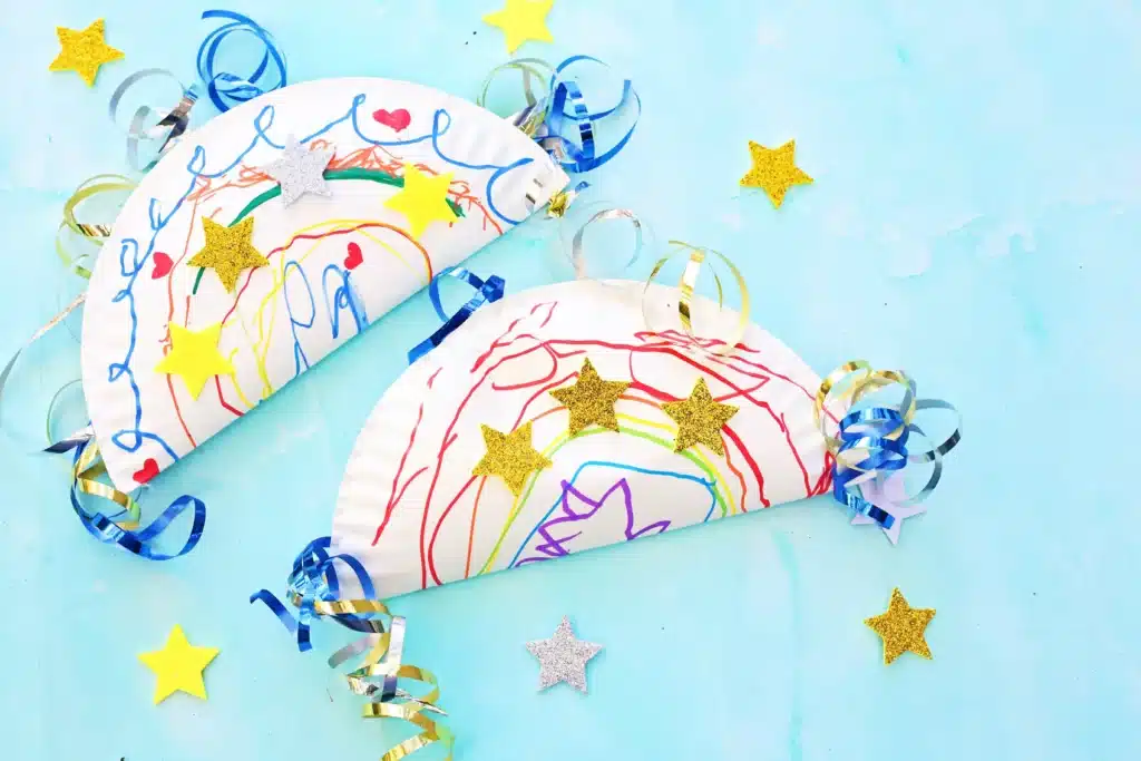 Paper Plate Noisemaker Craft - Cultivating Brilliant Minds a paper plate decorated and glued together with corn inside to make a noisemaker craft