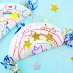 Paper Plate Noisemaker Craft - Cultivating Brilliant Minds a paper plate decorated and glued together with corn inside to make a noisemaker craft