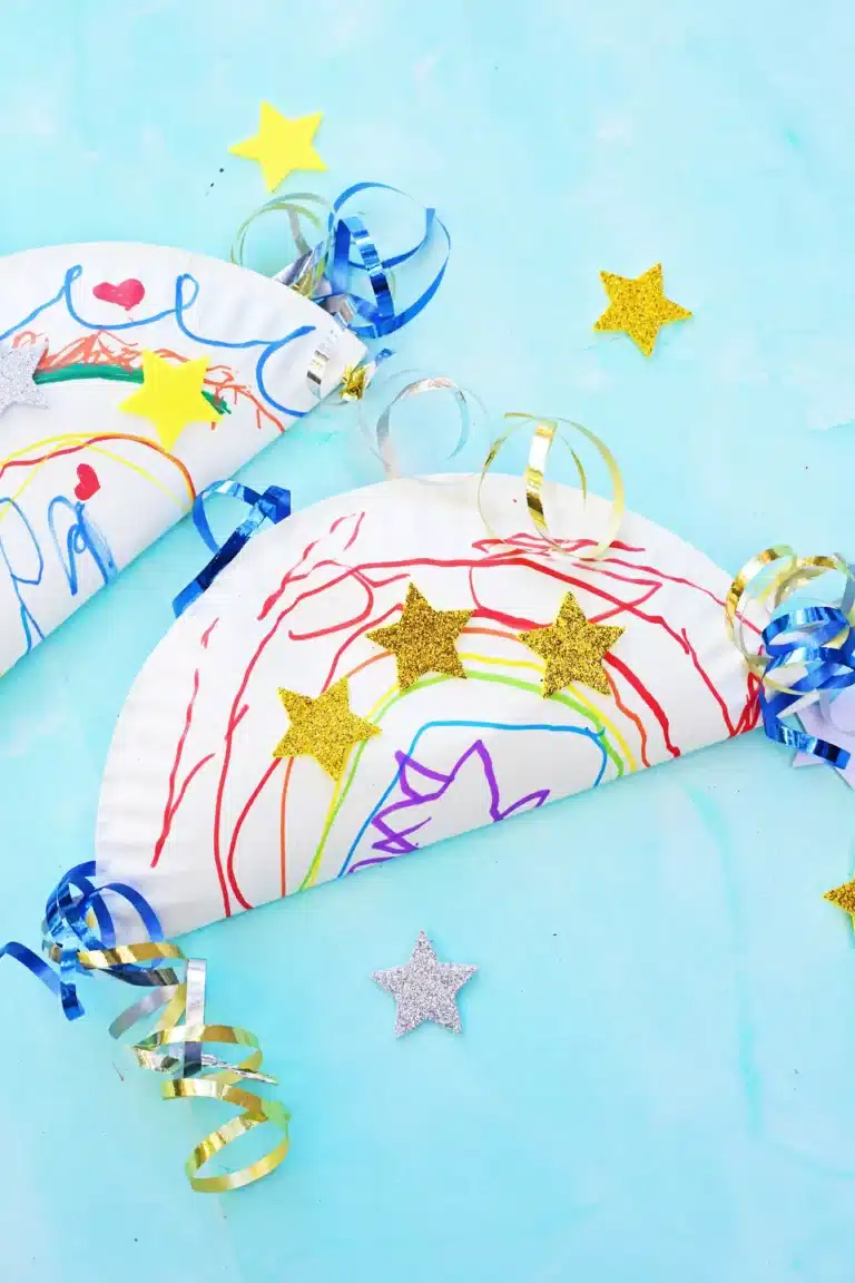 a paper plate decorated and glued together with corn inside to make a noisemaker craft