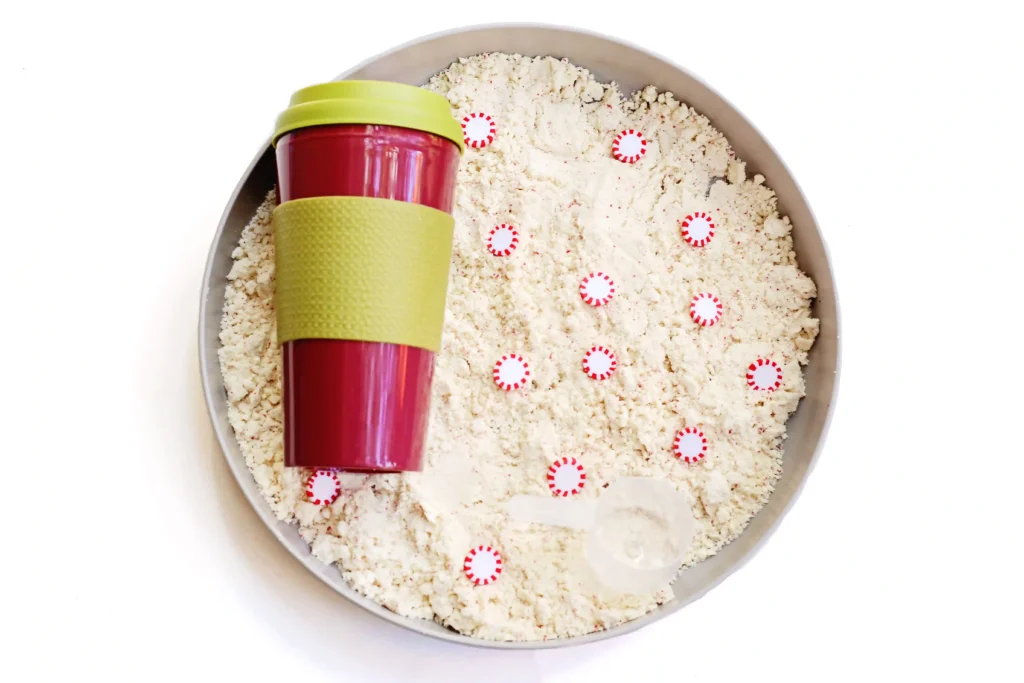 Peppermint Latte Cloud Dough Tray - Cultivating Brilliant Minds a cloud dough tray filled with peppermints