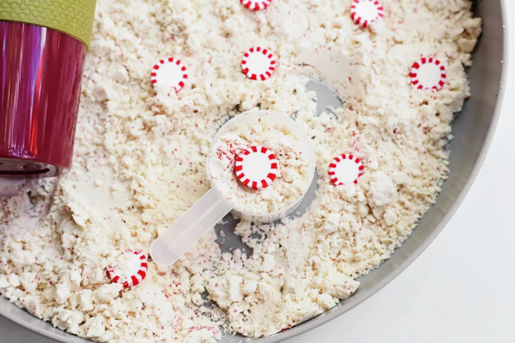 Peppermint Latte Cloud Dough Tray - Cultivating Brilliant Minds a cloud dough tray filled with peppermints