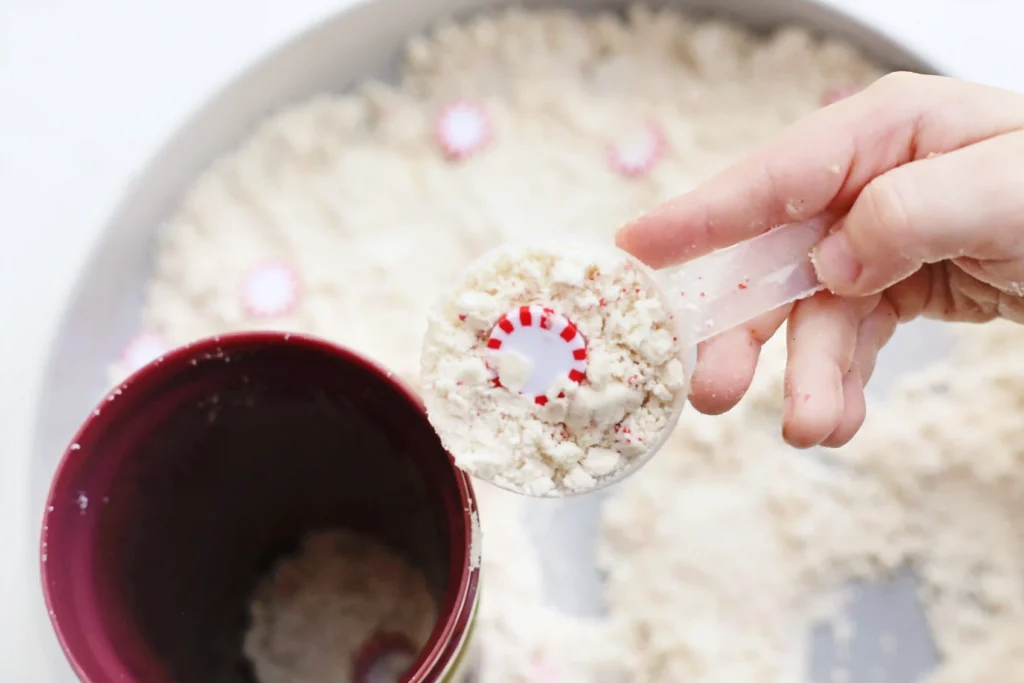 Peppermint Latte Cloud Dough Tray - Cultivating Brilliant Minds a cloud dough tray filled with peppermints