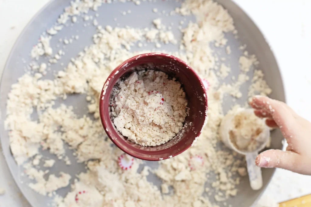 Peppermint Latte Cloud Dough Tray - Cultivating Brilliant Minds a cloud dough tray filled with peppermints