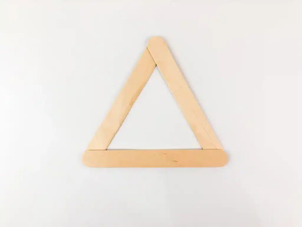 Santa Popsicle Stick Craft - Cultivating Brilliant Minds 3 popsicle sticks glued into a triangle