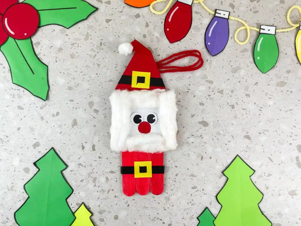 Santa Popsicle Stick Ornament Craft - Cultivating Brilliant Minds a santa popsicle stick ornament made with popsicle sticks and construction paper
