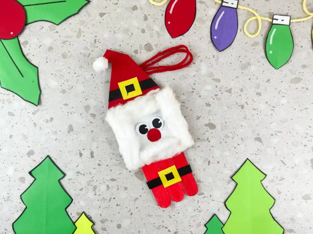 Santa Popsicle Stick Ornament Craft - Cultivating Brilliant Minds a santa ornament made with popsicle sticks and construction paper