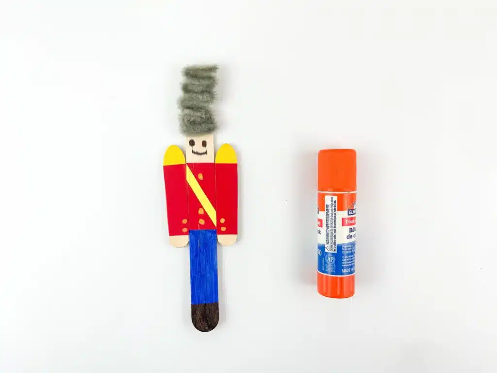 popsicle sticks decorated to look like a nutcracker