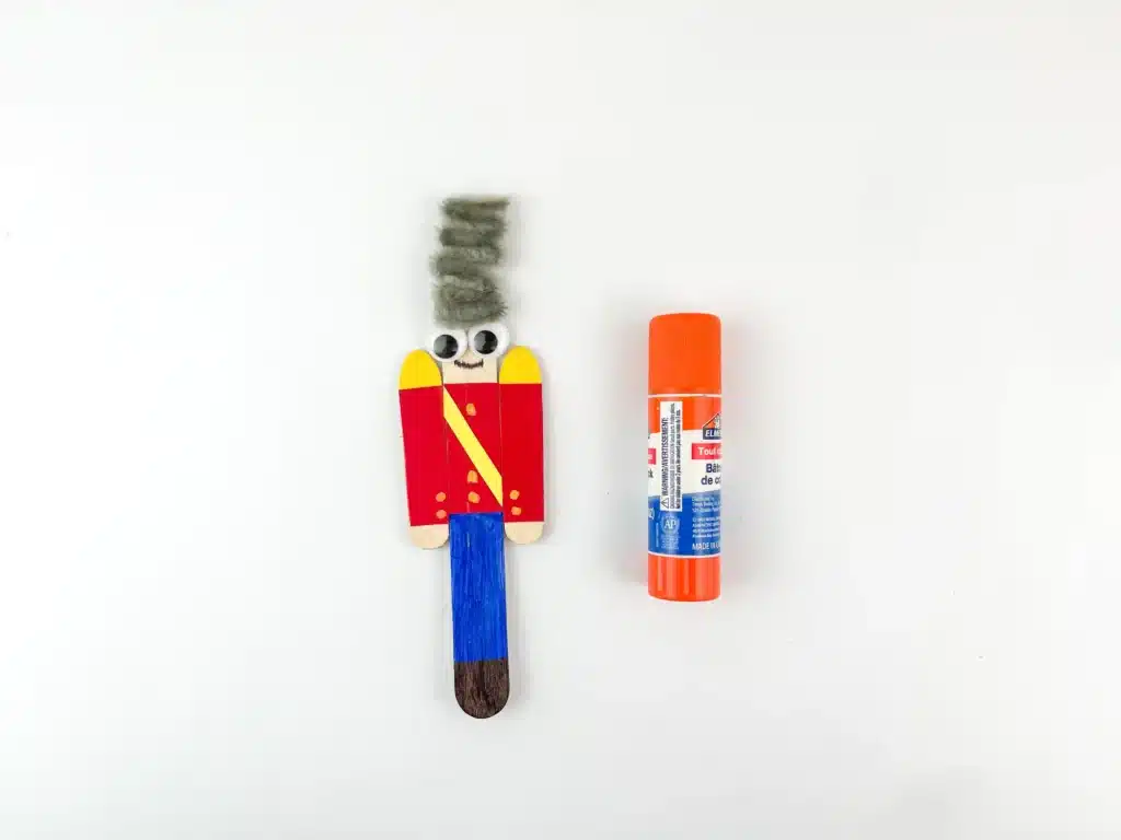 popsicle sticks decorated to look like a nutcracker