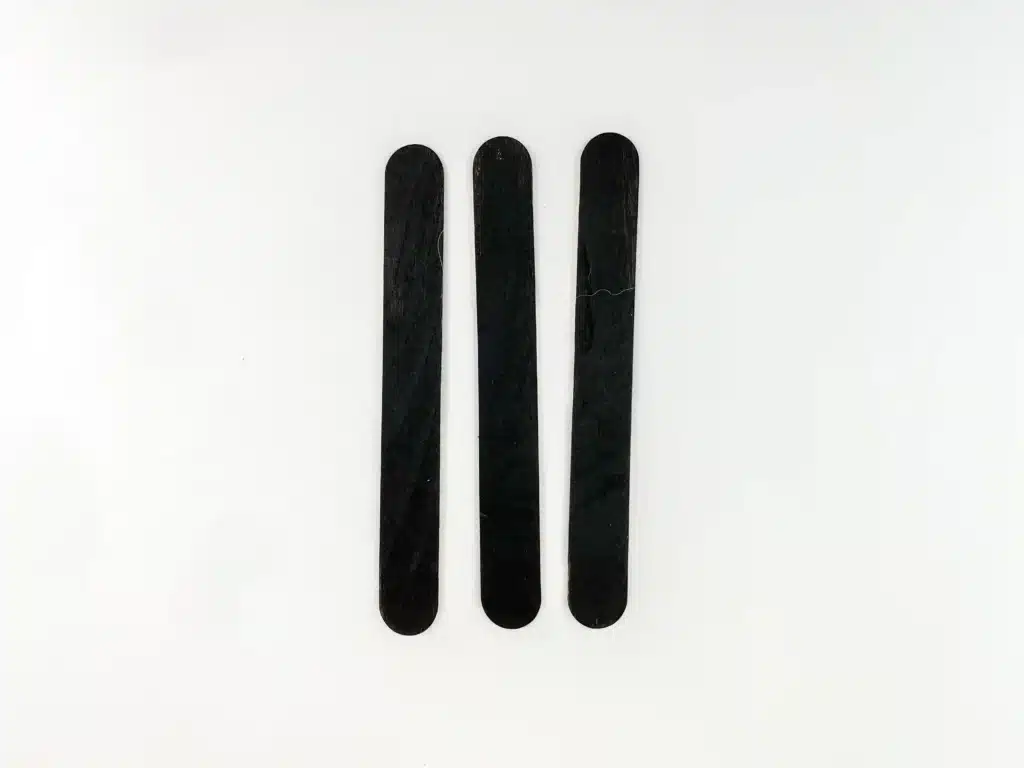 Penguin Ornament Craft - Cultivating Brilliant Minds 3 popsicle sticks painted black